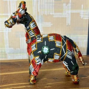 Cloth LLAMA with embroidered details throughout.World Market